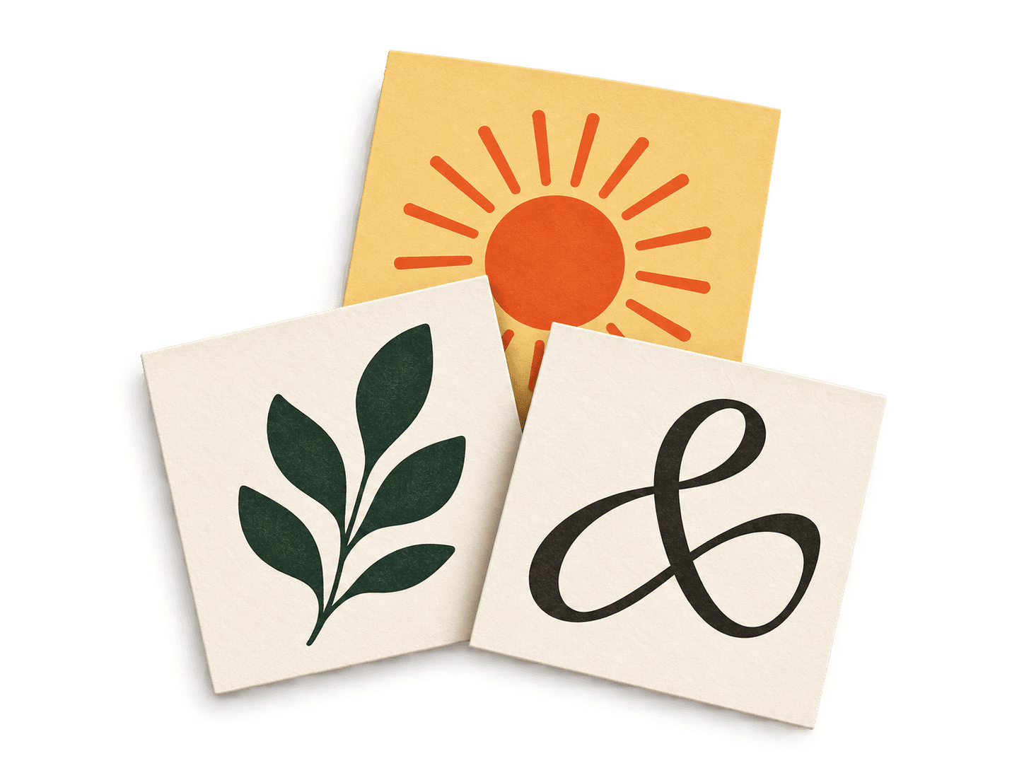 Three logo idea cards: an orange sun, a green leaf sprig, and a flowing script ampersand.