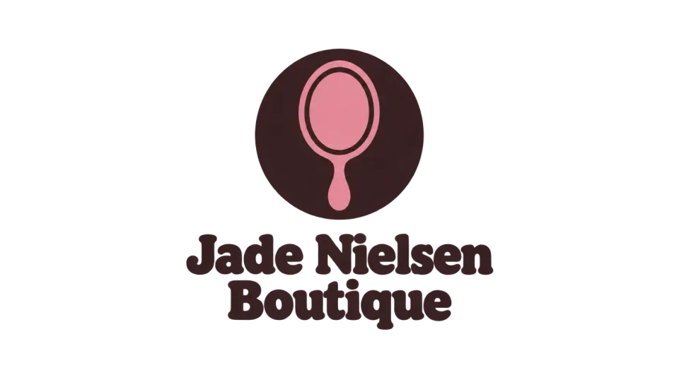 Jade Nielsen Boutique combination mark logo idea: The handheld mirror makes the boutique connection immediate, and the centered arrangement gives Jade Nielsen Boutique a neat, friendly mark for small printed spaces.