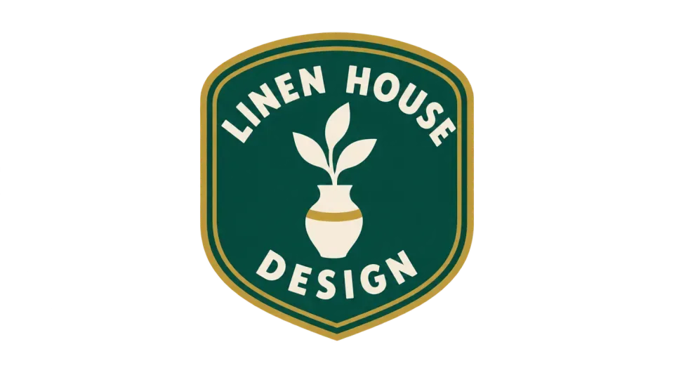 Linen House Design emblem logo idea: A jaunty vase and leaf give Linen House Design a welcoming, shopfront feel while the shield keeps the name together.