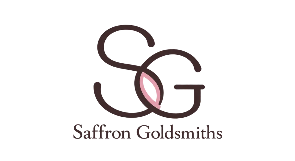 Saffron Goldsmiths lettermark logo idea: A softly linked SG gives Saffron Goldsmiths a distinctive compact mark, with a warm blush detail to bring a natural touch.