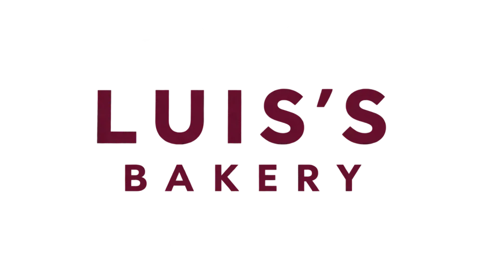 Luis's Bakery wordmark logo idea: The wider top line and airy lettering make the two-line name feel cheerful without adding anything beyond the bakery's name.