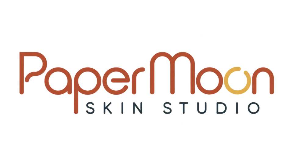 Paper Moon Skin Studio wordmark logo idea: The open circular O gives “Moon” a quiet radiant detail, while the clean lettering keeps the complete studio name front and center.