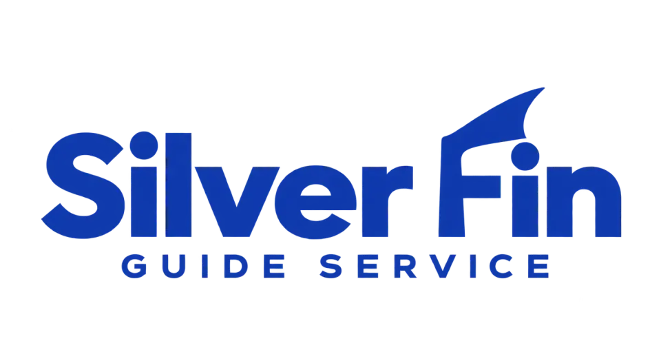 Silver Fin Guide Service wordmark logo idea: A fin-shaped stroke in “Fin” gives the name a subtle fishing cue while keeping the service name easy to read.