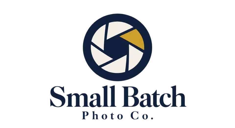 Small Batch Photo Co. combination mark logo idea: A single gold wedge of light entering a navy lens gives the stacked name a moody, artistic photography cue.